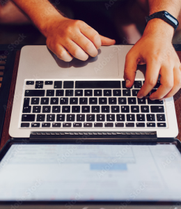 Developer typing on laptop
